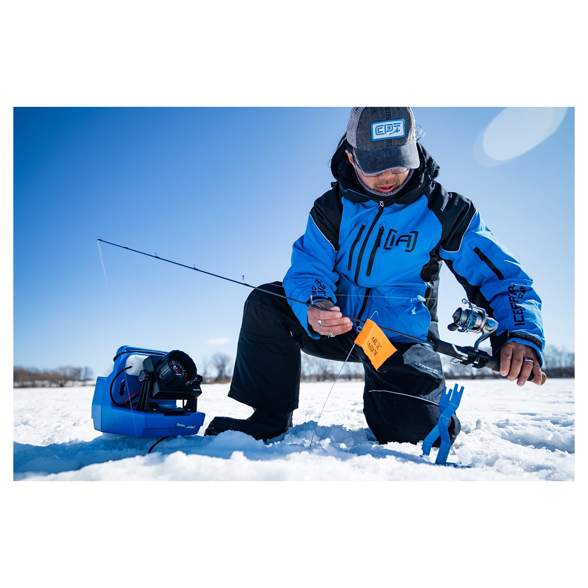 Clam Outdoors Arctic Warrior Tip Up with rod in the field