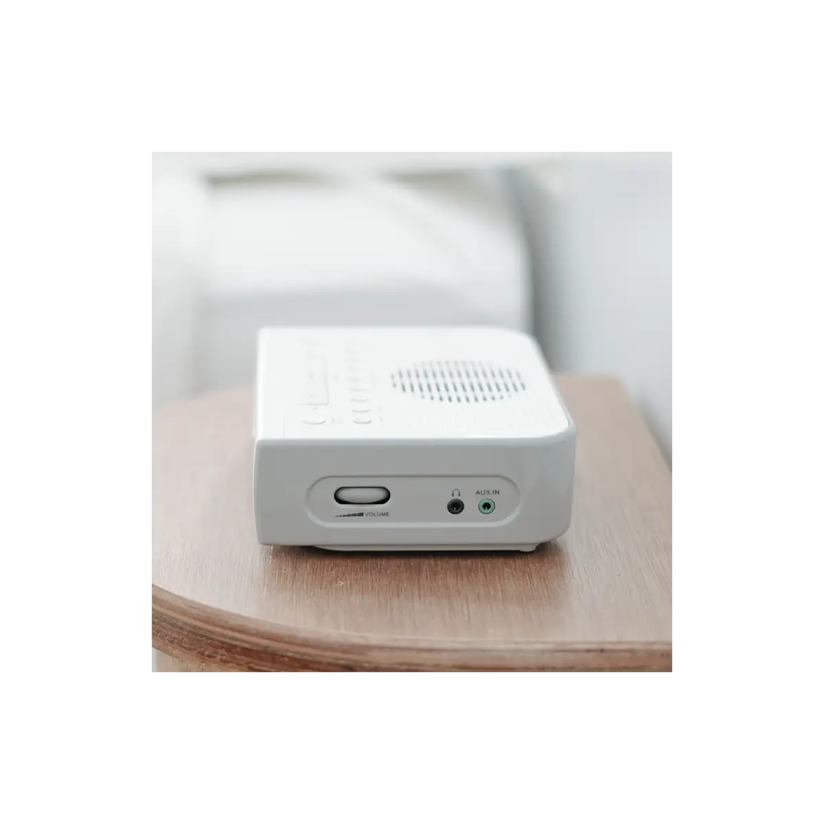 Sangean RCR-5 AM/FM Digital Tuning Radio in white sitting on desk with right side showing